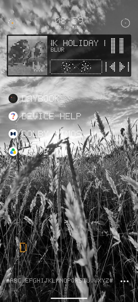 Now playing card with halftone album art and a cassette animation, above a short app list on a black and white photo