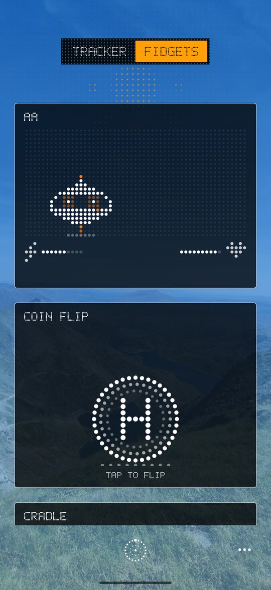 Fidgets page with the dot-matrix saucer pet hovering in its box above a coin flip card